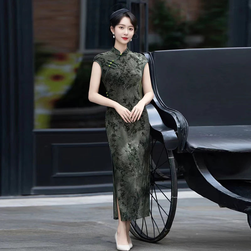 Full-length green bamboo sleeveless qipao with a stand collar, shown beside a black piano