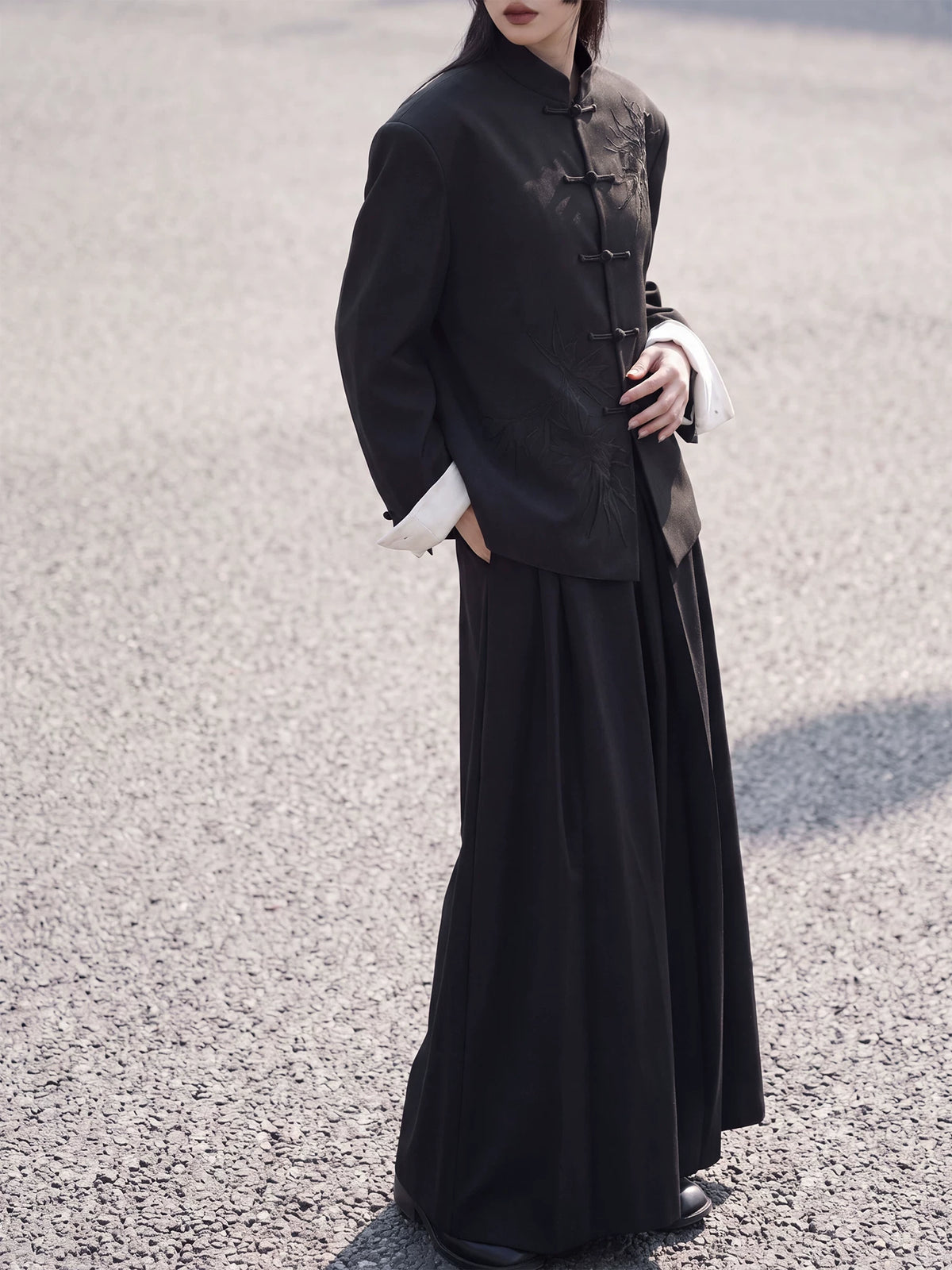 Full-length styling view of the black bamboo blazer