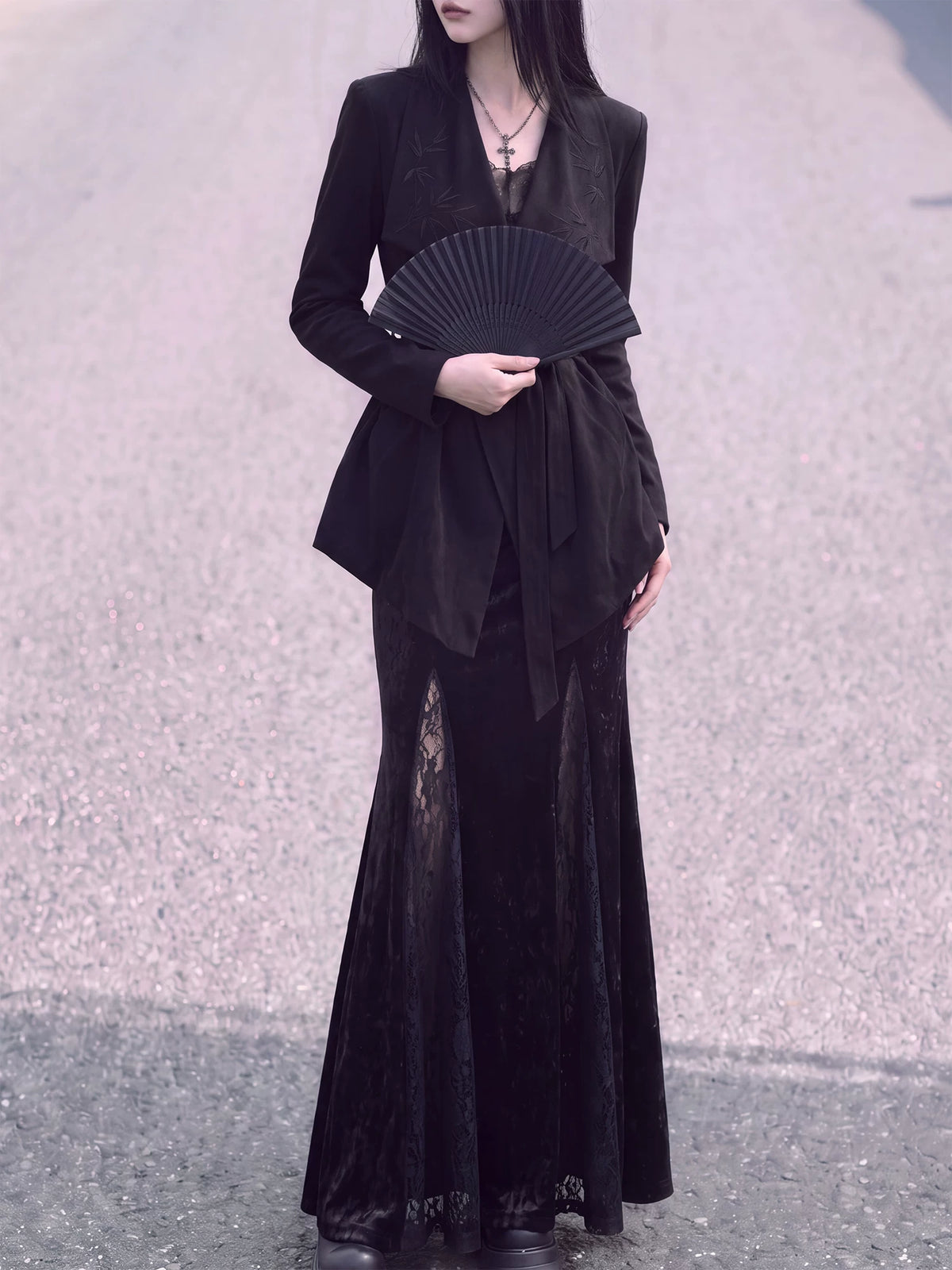Full-length styling view of the black bamboo wrap jacket