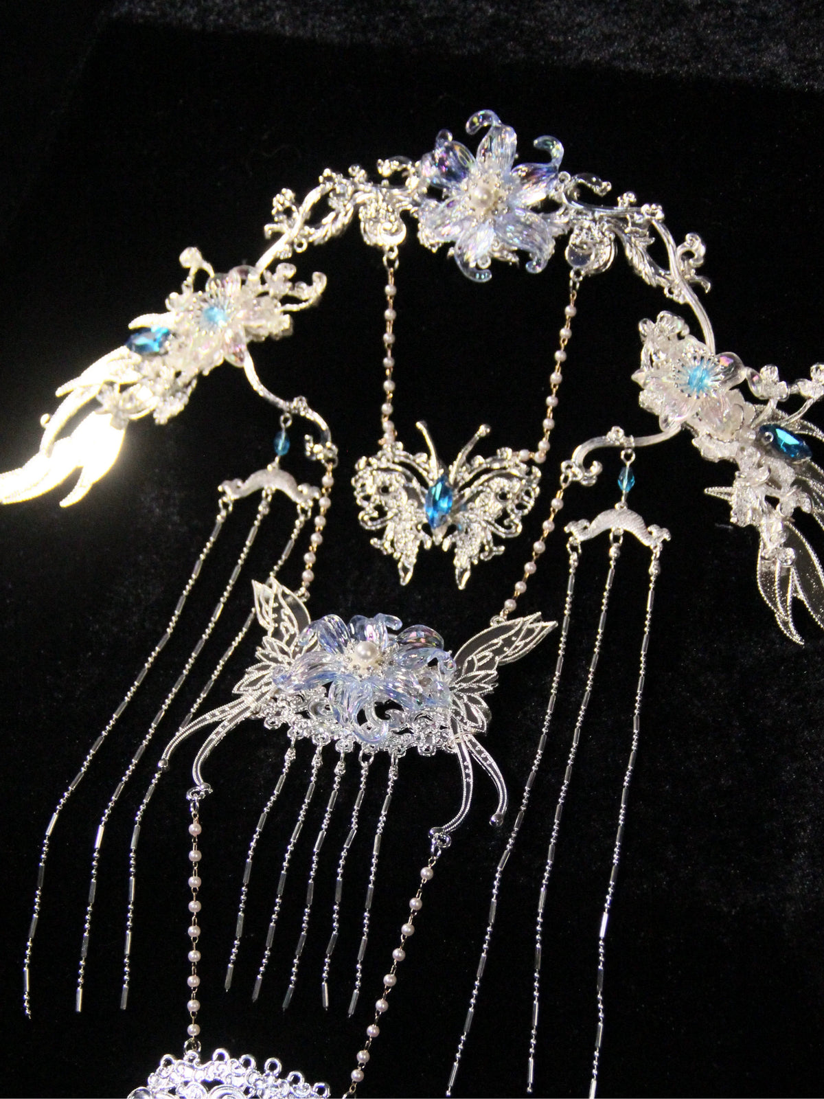 Ice Blossom back tassel ornament displayed on a stand