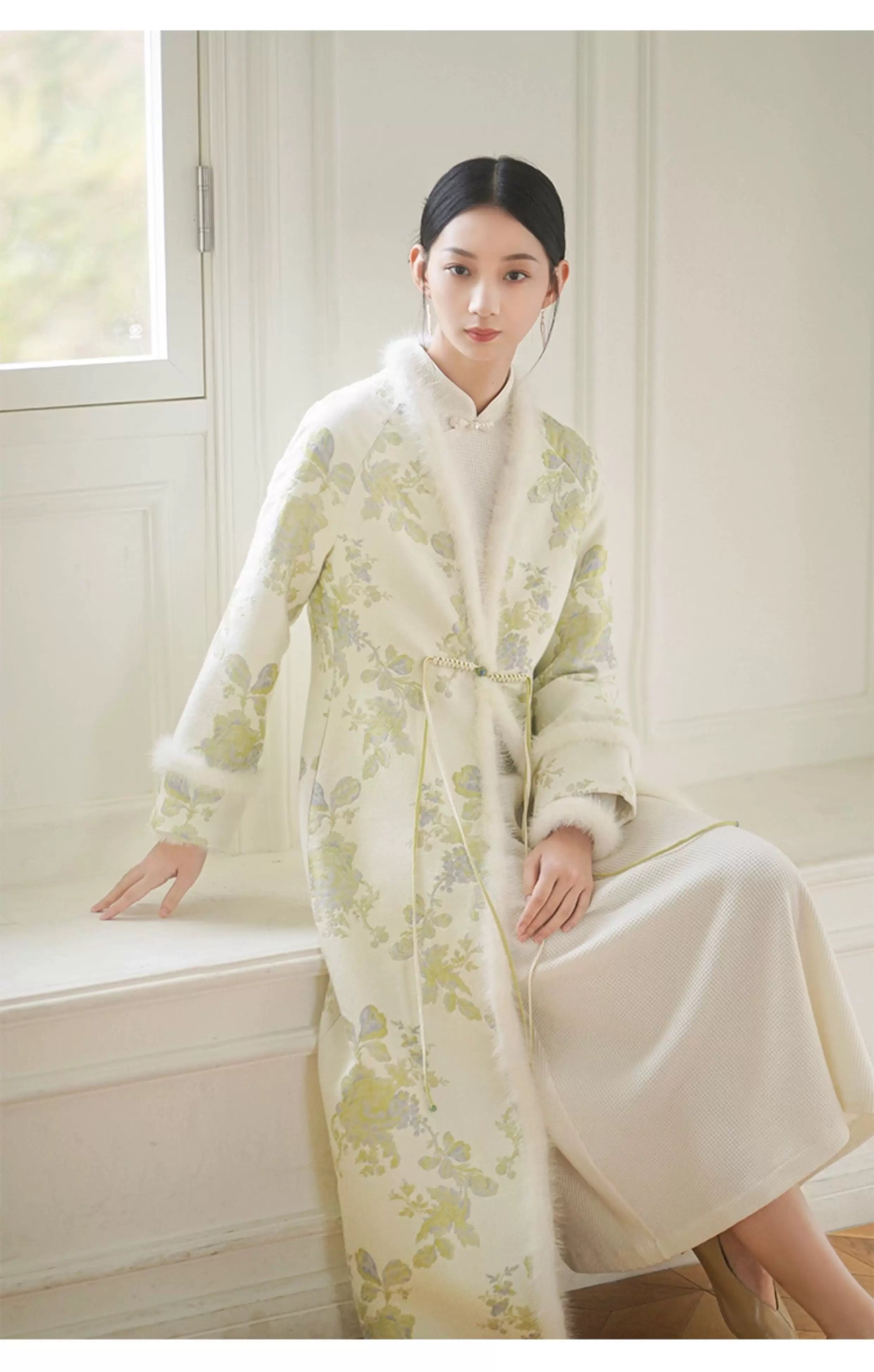 Occasion styling image of the Ivory-Green woven floral wool-blend long coat, presented as an elegant New Chinese Style coat.