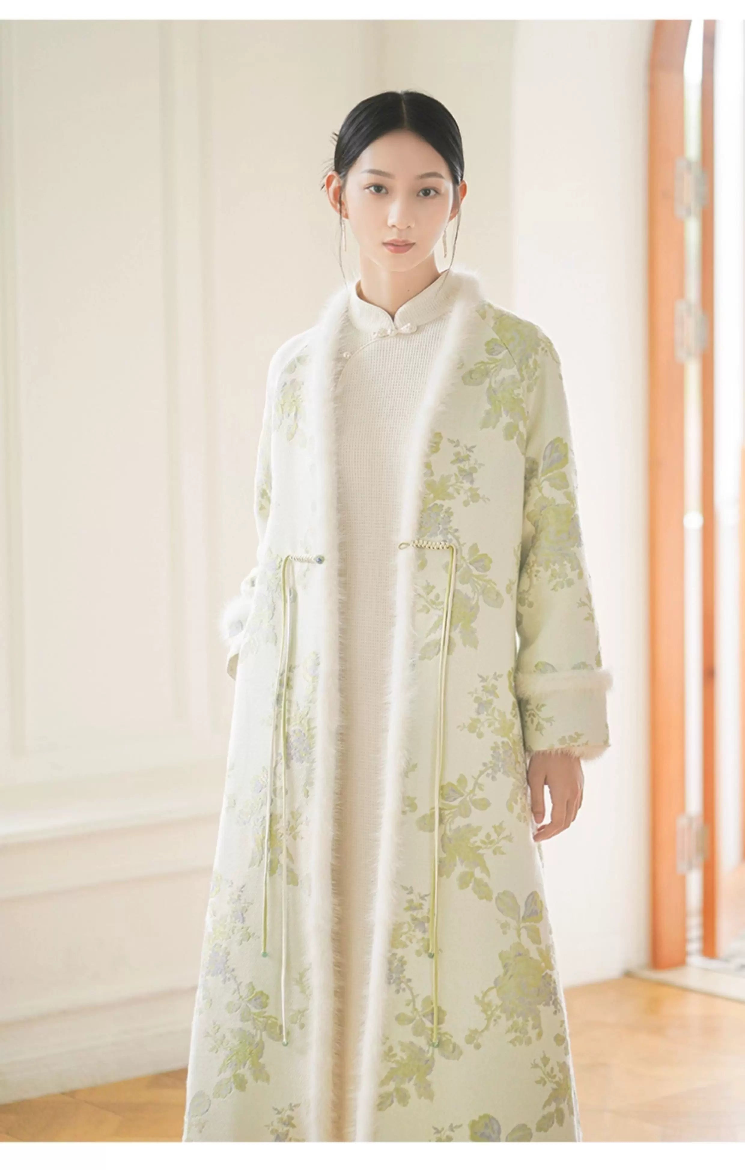 Occasion styling image of the Ivory-Green woven floral wool-blend long coat, presented as an elegant New Chinese Style coat.