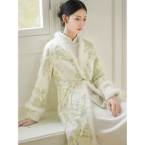 Additional styling view of the Ivory-Green woven floral wool-blend long coat, showing the garment's shape, texture and finish.
