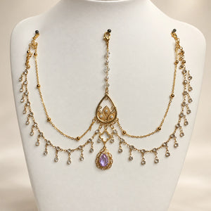 Purple forehead chain on a display bust