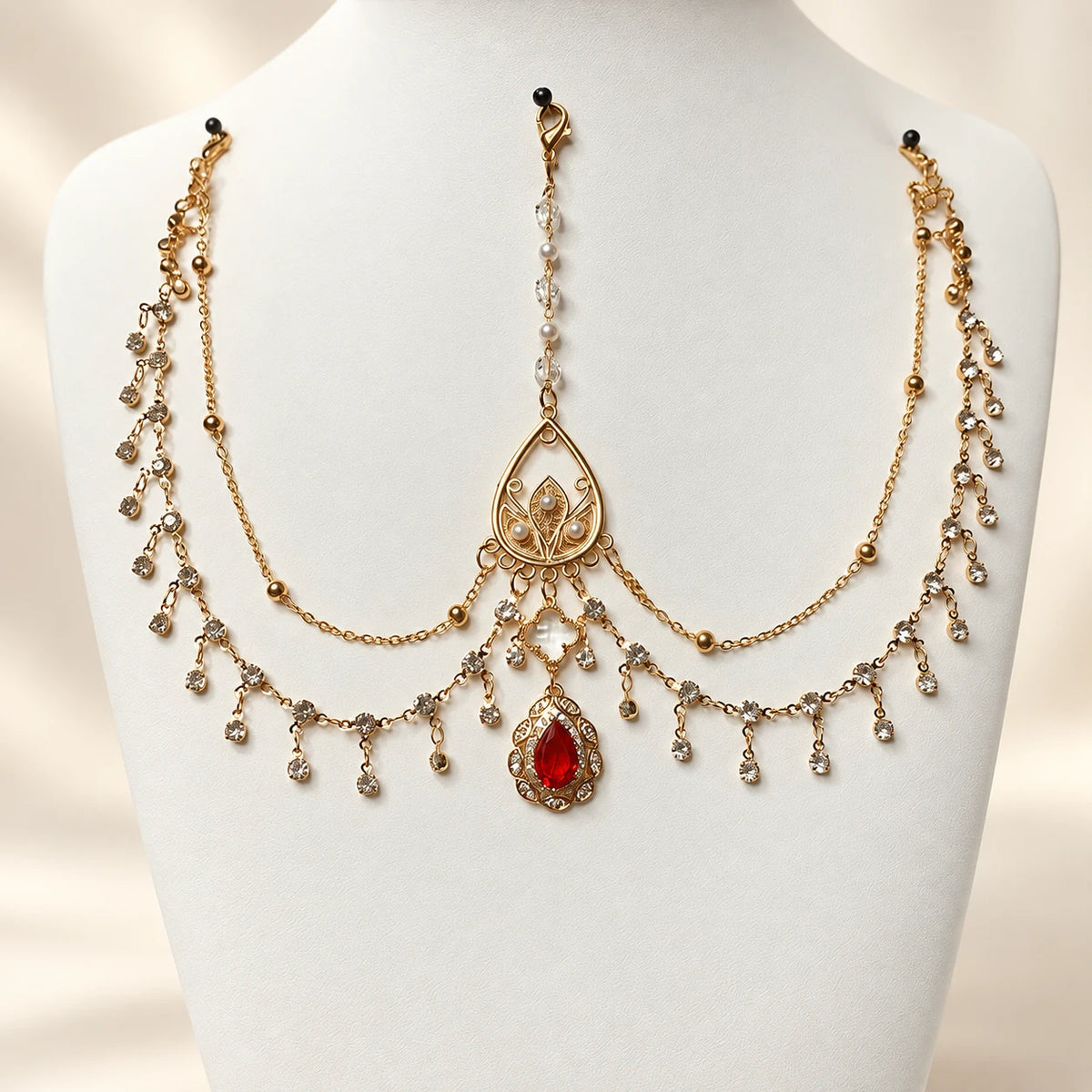 Red forehead chain on a display bust
