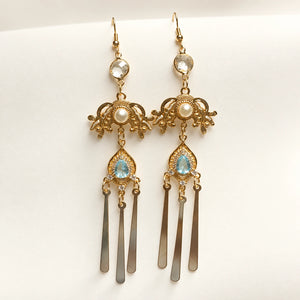 Long matching earrings with blue accents