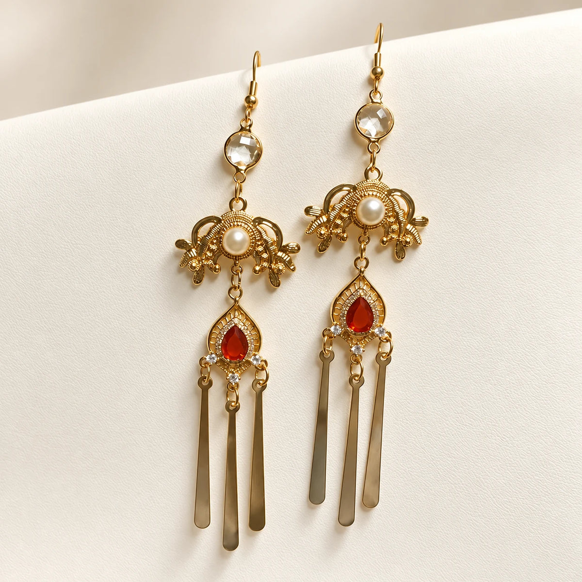 Long matching earrings with red accents