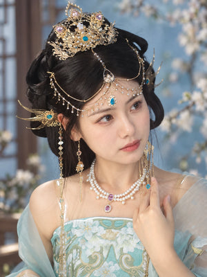 Gold-tone Jiaoren crown with blue and purple accents