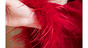 Close-up of red ostrich-feather jacket cuff