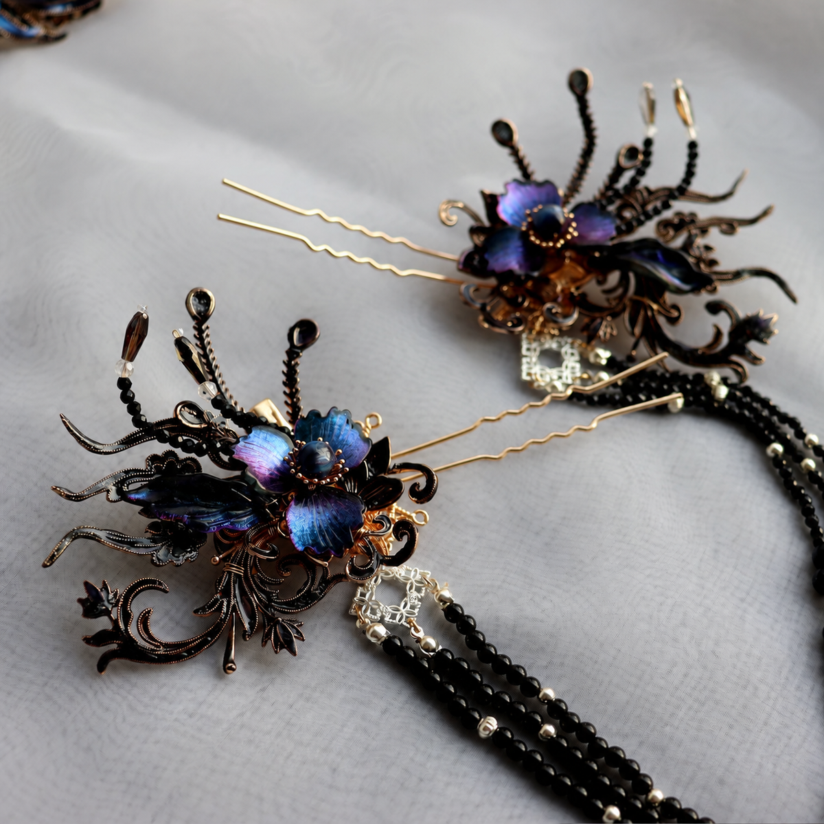 Pair of floral hairpins with long black beaded tassels