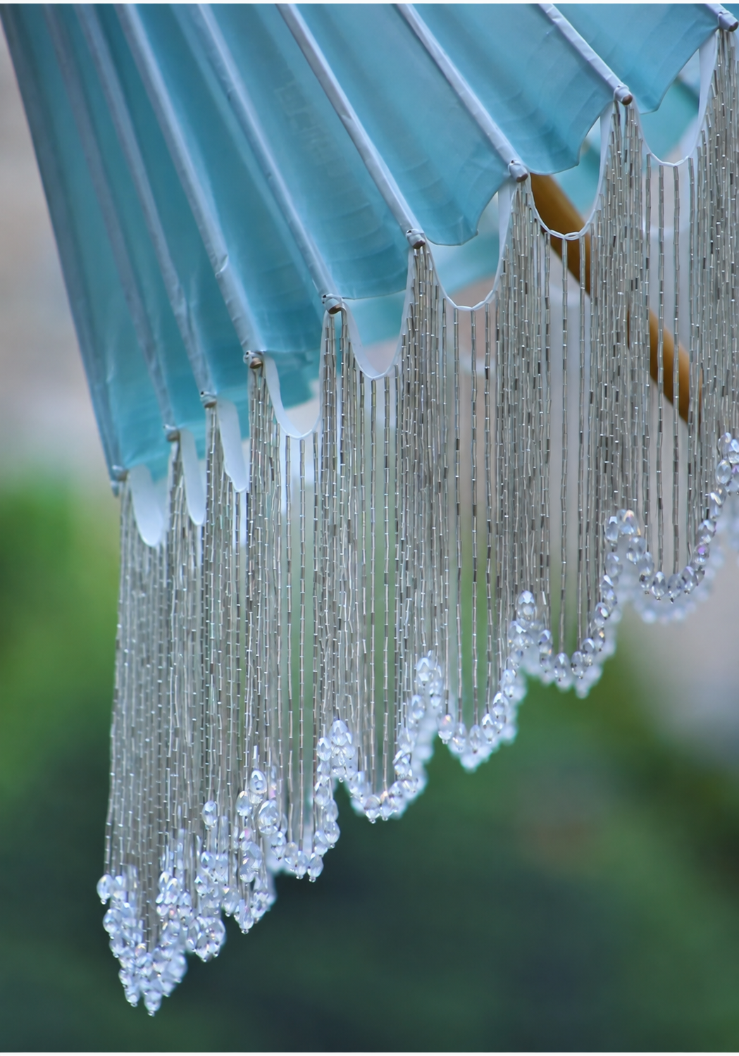 Ice-blue canopy scallops and cascading silver-tone beaded tassel details