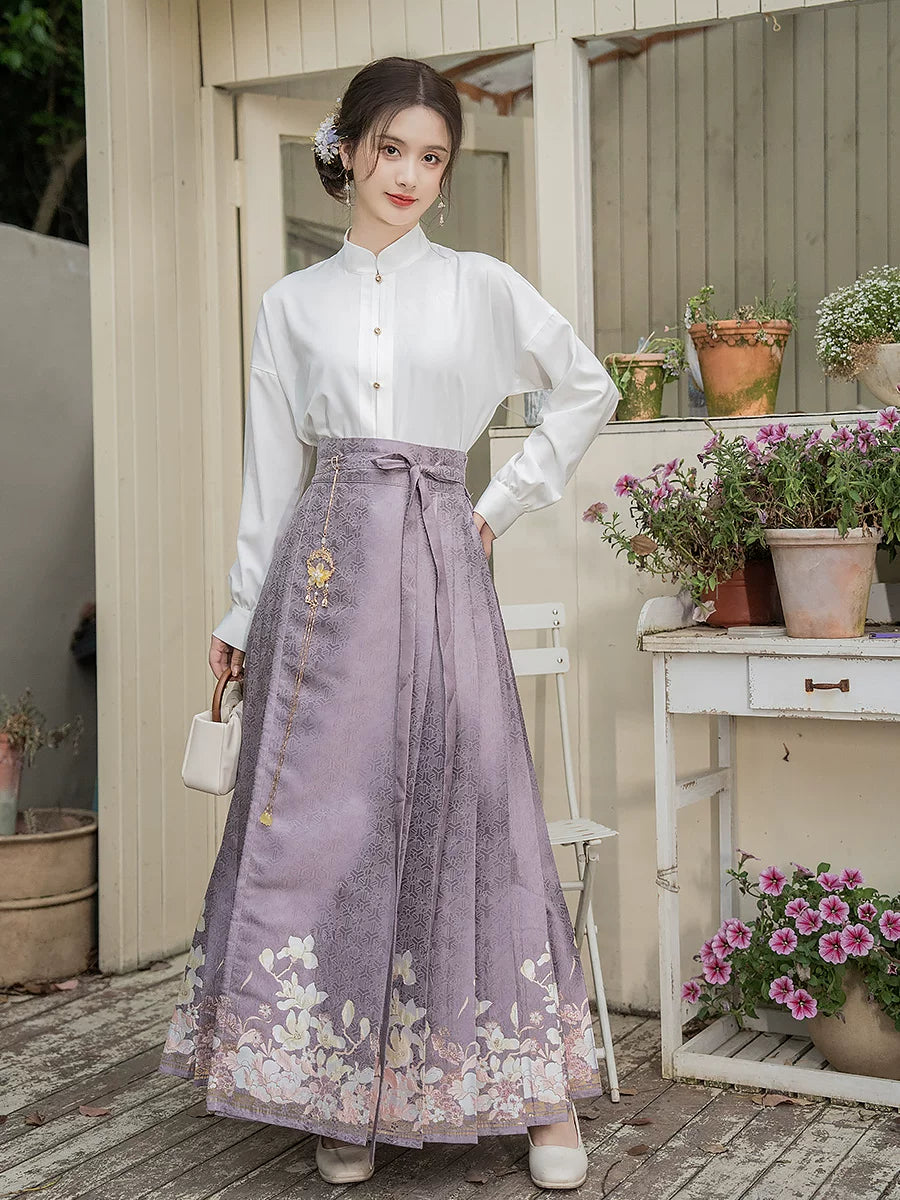 Front view of the purple magnolia skirt with a white standing-collar blouse