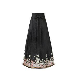 Black magnolia mamian skirt with a cream and pale pink floral border