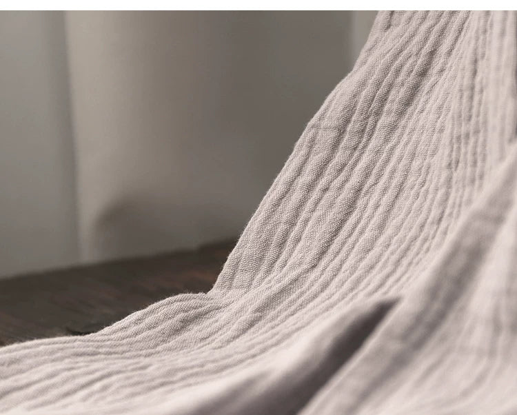 Folded gray top and pants set showing breathable cotton gauze construction
