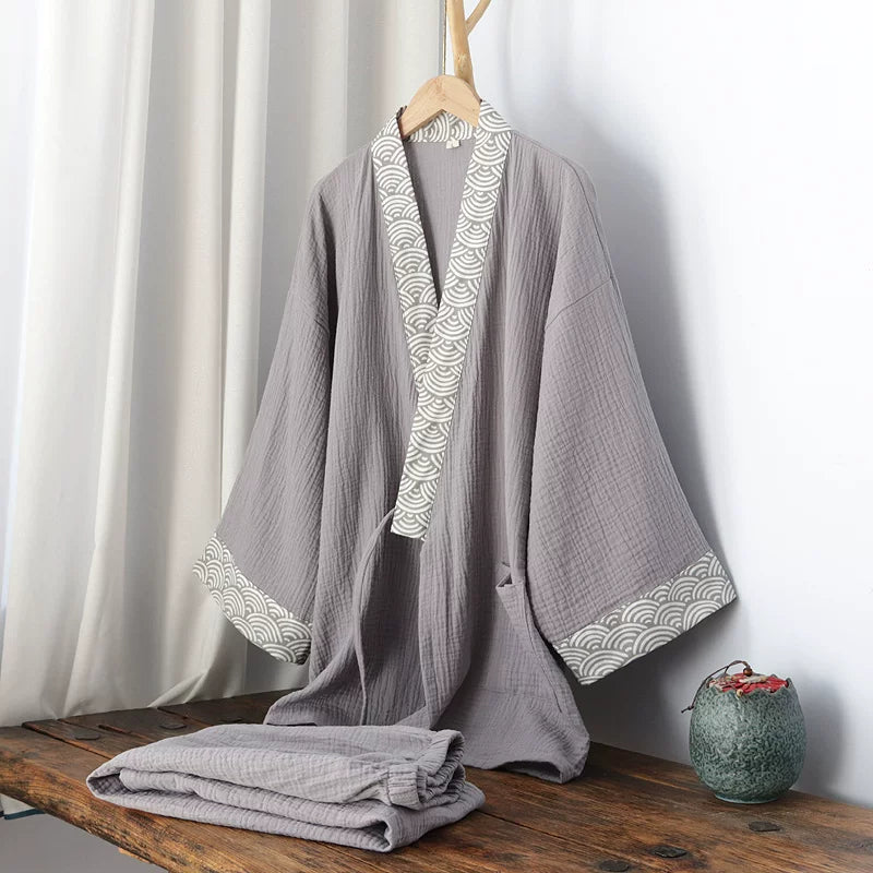 Wave-pattern crossover collar detail on the men's gray cotton gauze top