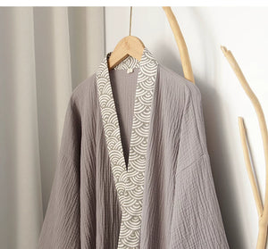 Wide sleeve and wave-trim cuff detail on the gray loungewear top