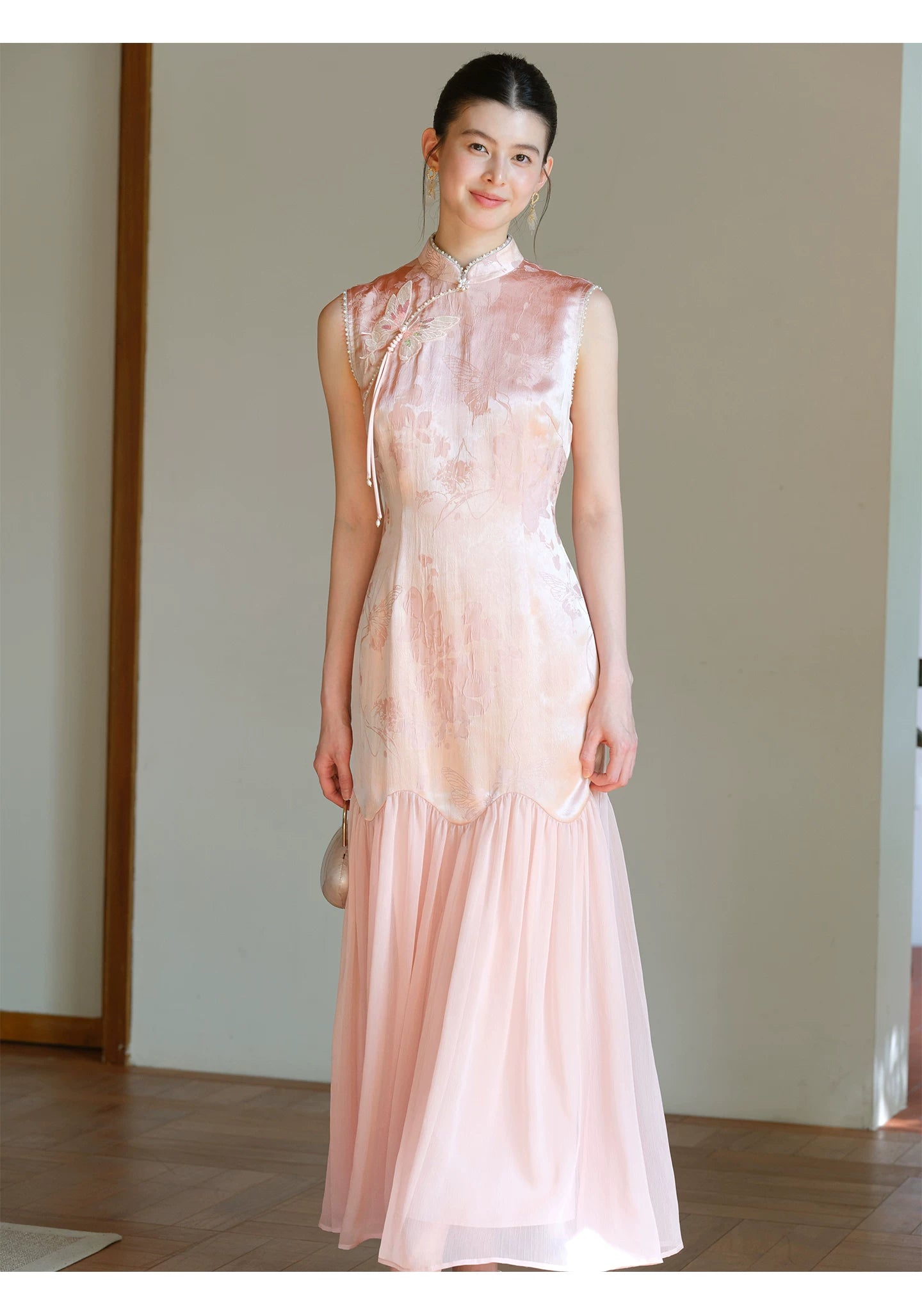 Occasion styling image of the Misty Blush floral jacquard cheongsam dress, presented as an elegant modern pink qipao dress.