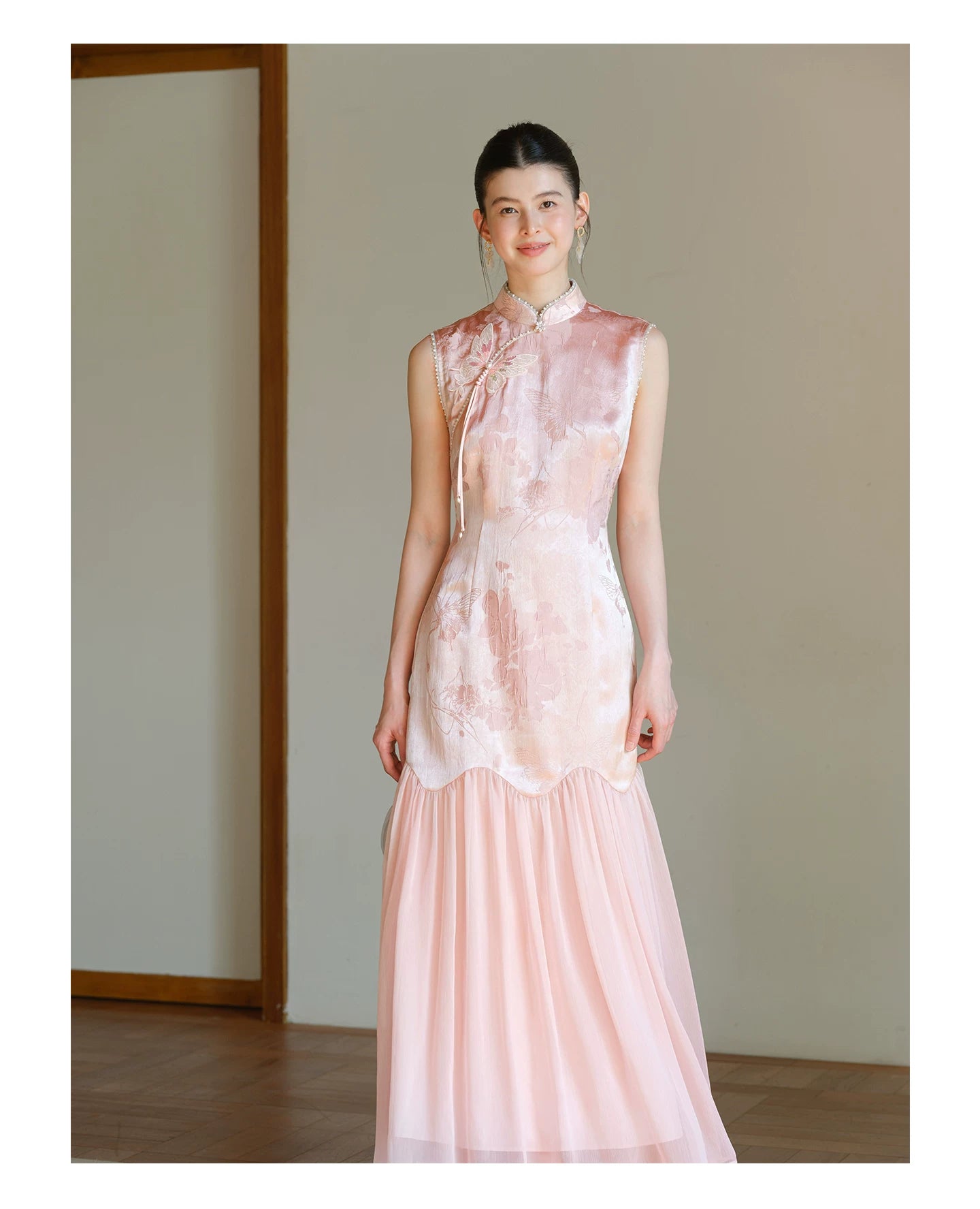 Additional styling view of the Misty Blush floral jacquard cheongsam dress, showing the garment's shape, texture and finish.