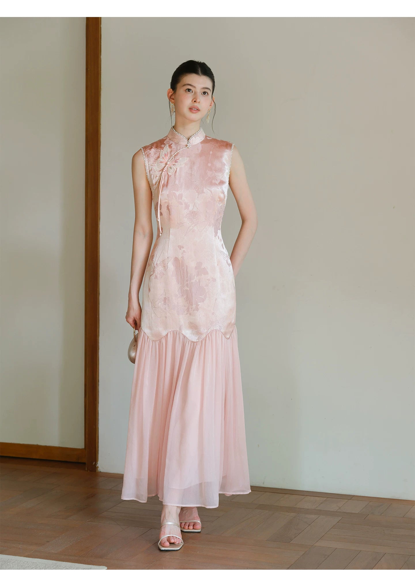 Front styling view of the Misty Blush floral jacquard cheongsam dress, with floral jacquard texture, fitted waist and elegant long silhouette.