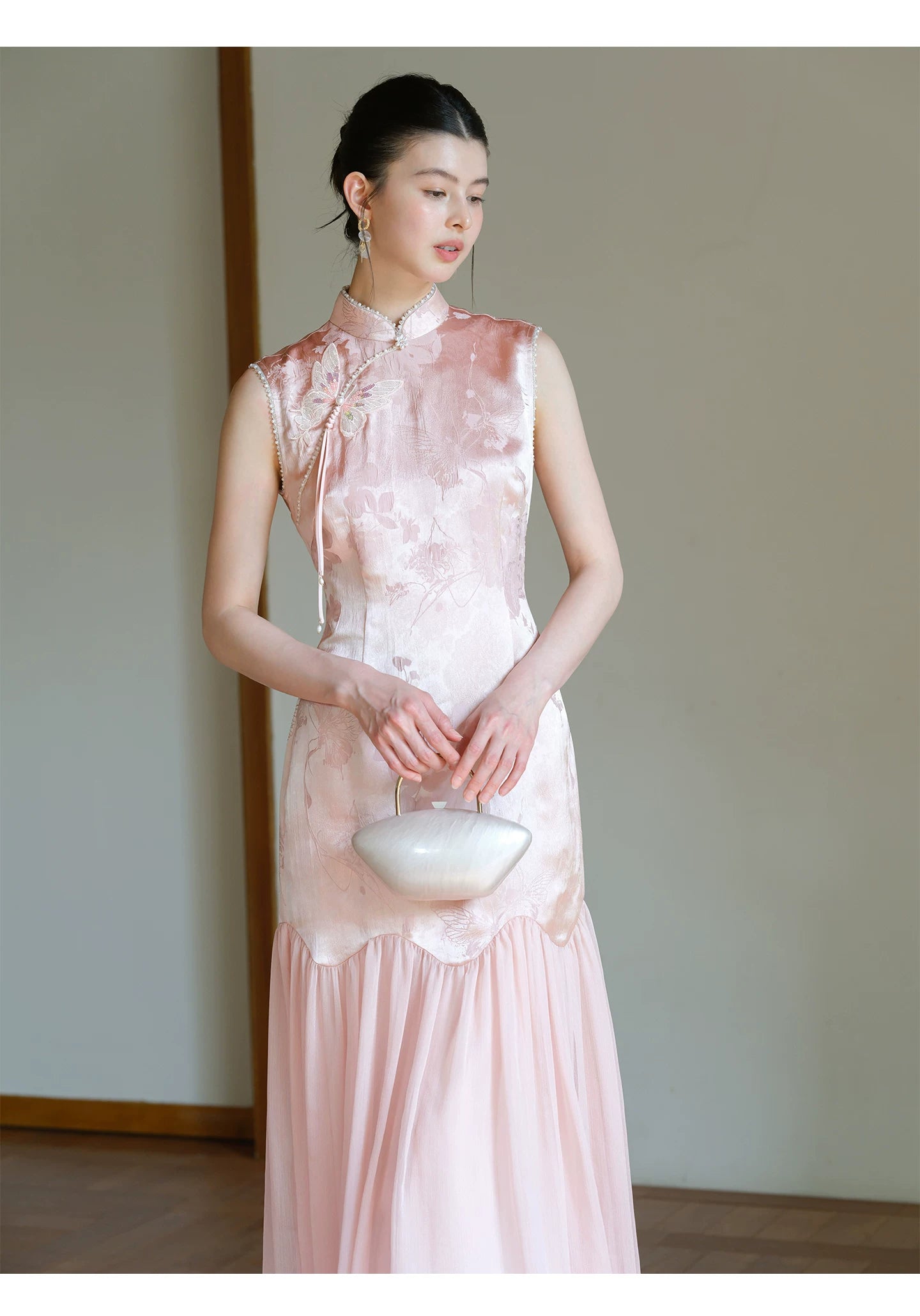 Three-quarter product view of the Misty Blush floral jacquard cheongsam dress, a refined modern pink qipao dress for elegant occasions.