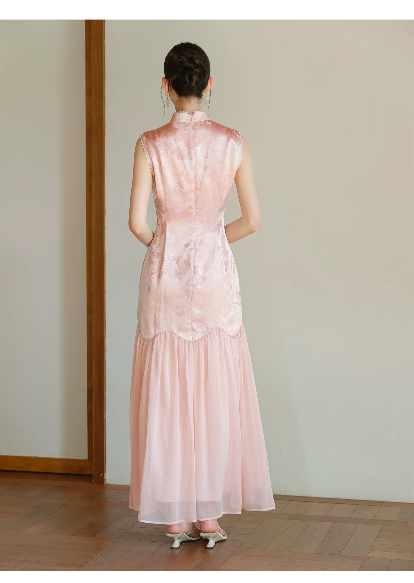 Design view of the Misty Blush floral jacquard cheongsam dress, highlighting floral jacquard texture, fitted waist and elegant long silhouette.