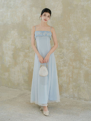 Design view of the Moonlight Blue embroidered A-line slip dress, highlighting delicate embroidery, clean A-line shape and elegant blue palette.