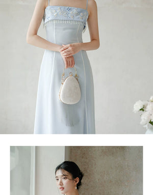 Occasion styling image of the Moonlight Blue embroidered A-line slip dress, presented as an elegant modern Chinese dress.