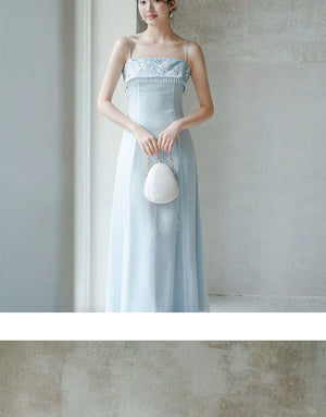 Moonlight Blue embroidered A-line slip dress shown as a polished modern Chinese dress, highlighting delicate embroidery, clean A-line shape and elegant blue palette.
