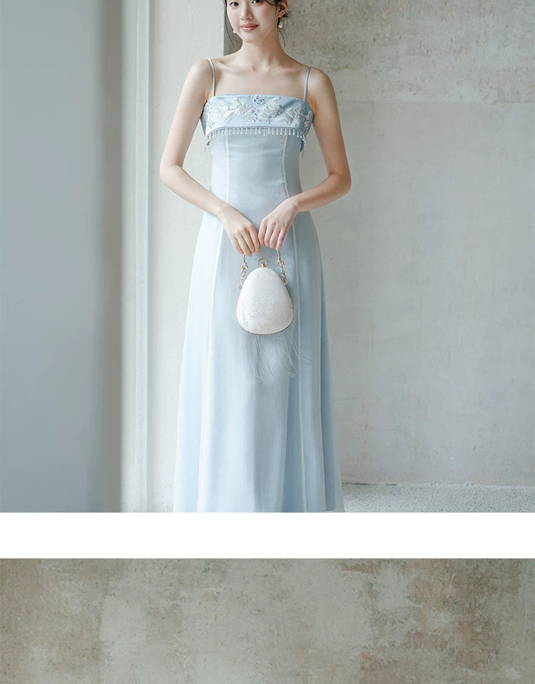 Moonlight Blue embroidered A-line slip dress shown as a polished modern Chinese dress, highlighting delicate embroidery, clean A-line shape and elegant blue palette.