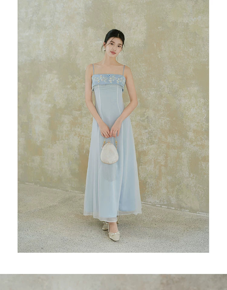 Design view of the Moonlight Blue embroidered A-line slip dress, highlighting delicate embroidery, clean A-line shape and elegant blue palette.
