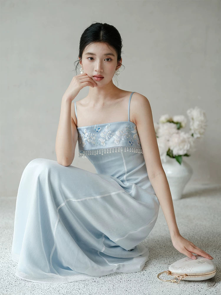 Moonlight Blue embroidered A-line slip dress shown as a polished modern Chinese dress, highlighting delicate embroidery, clean A-line shape and elegant blue palette.