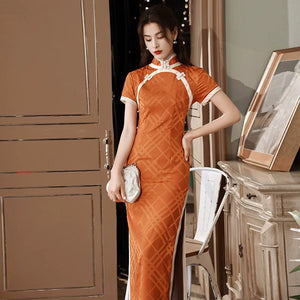 Orange diamond-pattern qipao with short sleeves and contrasting white curved trim