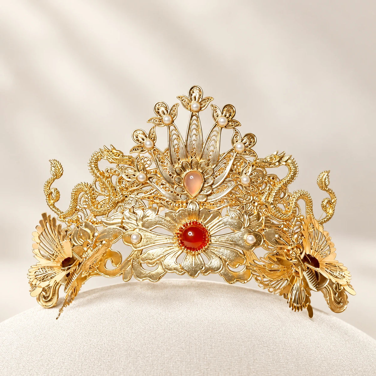 Gold-tone phoenix crown with red agate details