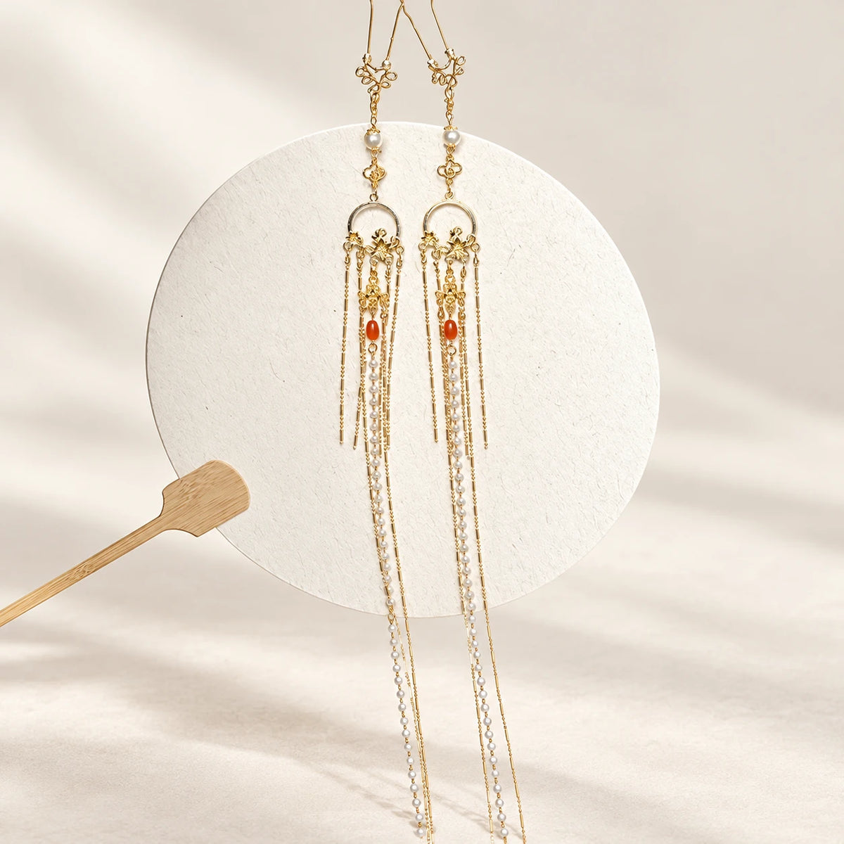 Extra-long tassel hairpins displayed as a pair