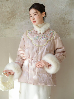 Front styling view of the Pink-Lilac jacquard down jacket with fur trim, with jacquard shell, plush fur trim and warm cropped silhouette.