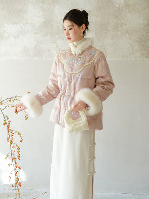 Pink-Lilac jacquard down jacket with fur trim styled to show its fit and drape, including jacquard shell, plush fur trim and warm cropped silhouette.