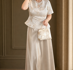 Champagne Chinese engagement outfit detail showing jacquard top, keyhole neckline and skirt sheen