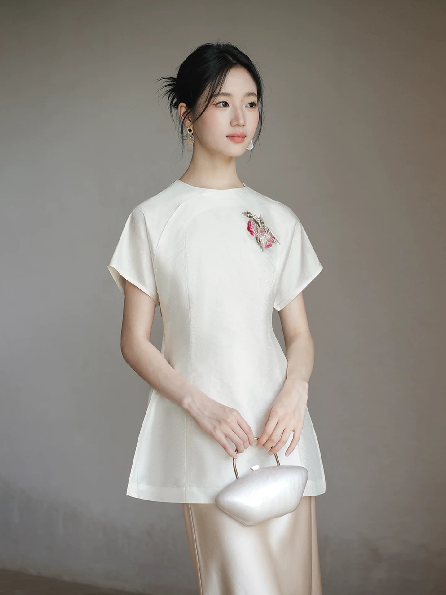 Three-quarter product view of the Porcelain-Moon mulberry silk top and champagne skirt, a refined New Chinese Style silk outfit for elegant occasions.