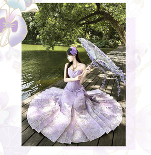 Purple pleated mamian skirt beside a garden pond