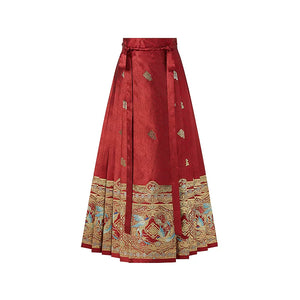 Red mamian skirt with tie waistband and an ornate woven magpie border