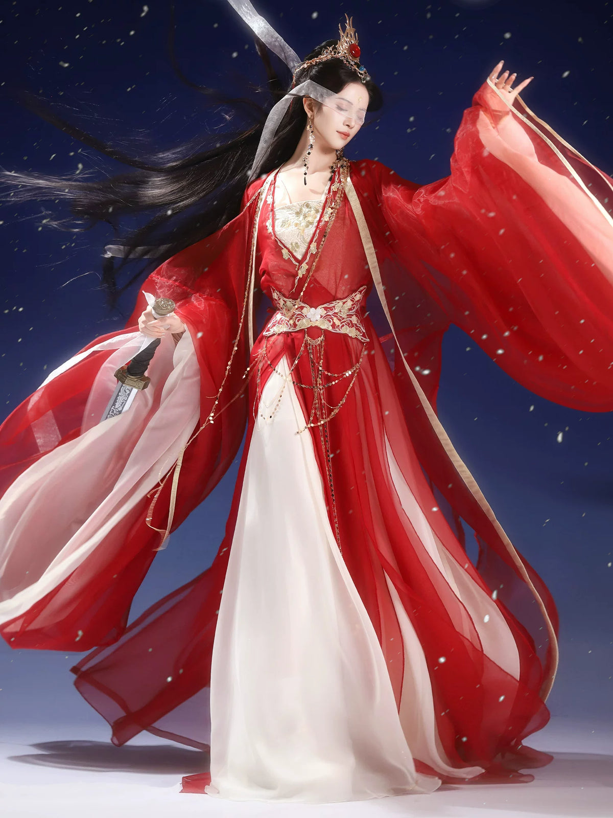 Red outer robe and ivory inner layers with long sleeve drape
