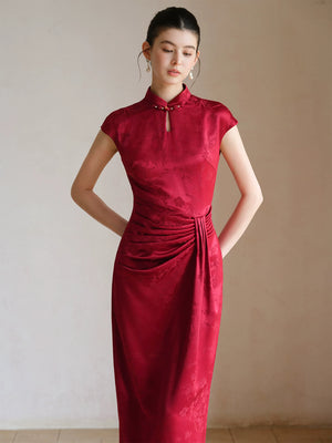 Design view of the Ruby Red acetate jacquard pleated qipao dress, highlighting acetate jacquard, sculpted pleats and elegant Chinese dress silhouette.
