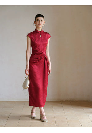 Ruby Red acetate jacquard pleated qipao dress styled to show its fit and drape, including acetate jacquard, sculpted pleats and elegant Chinese dress silhouette.