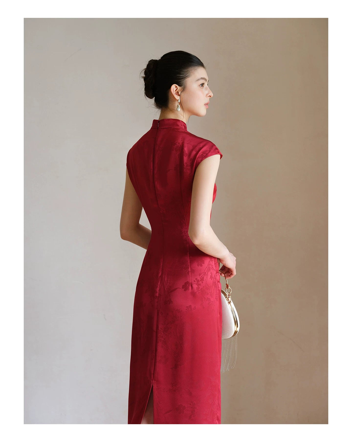 Silhouette and fit view of the Ruby Red acetate jacquard pleated qipao dress, a contemporary modern red qipao dress.