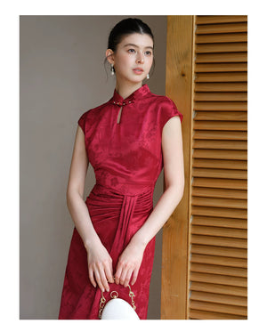 Additional styling view of the Ruby Red acetate jacquard pleated qipao dress, showing the garment's shape, texture and finish.