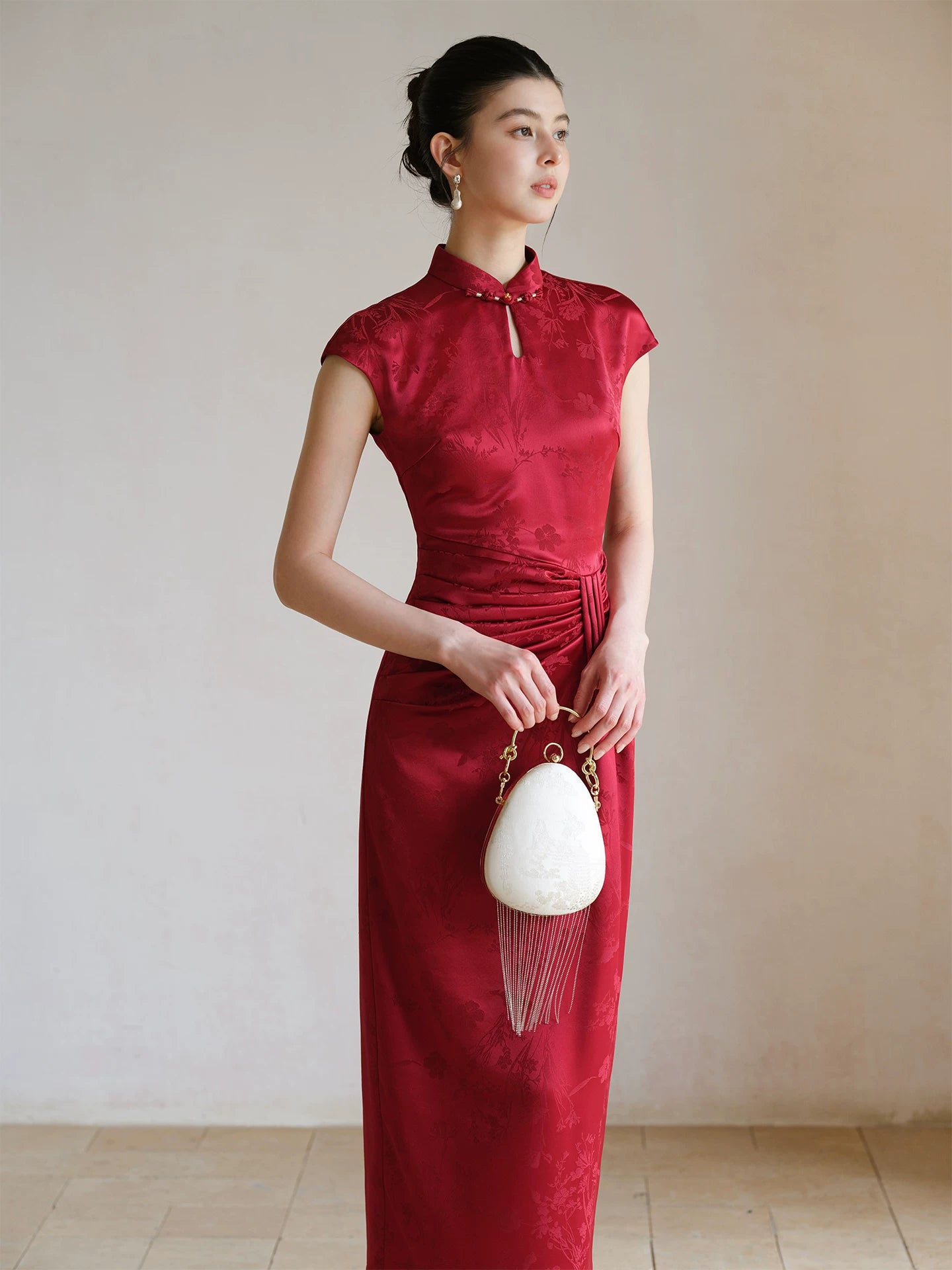Ruby Red acetate jacquard pleated qipao dress shown as a polished modern red qipao dress, highlighting acetate jacquard, sculpted pleats and elegant Chinese dress silhouette.