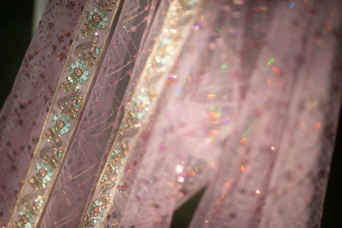 Detail of the pink robe neckline and long decorative front trim