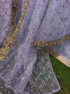 Detailed view of the purple robe open front with gold-tone bands and patterned sequin mesh