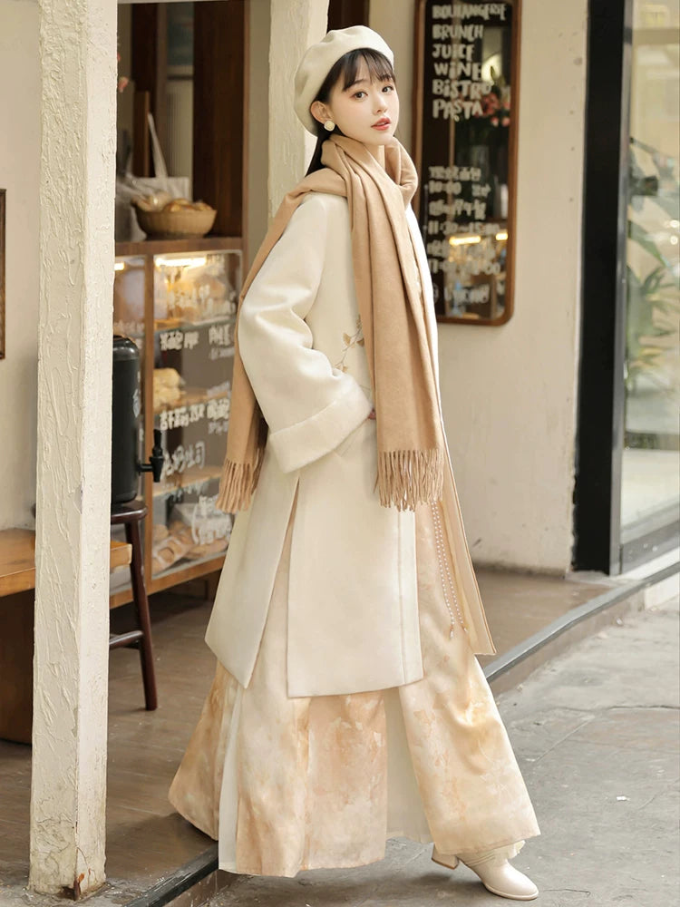Side view of the apricot modern Hanfu coat and long skirt styled with a scarf