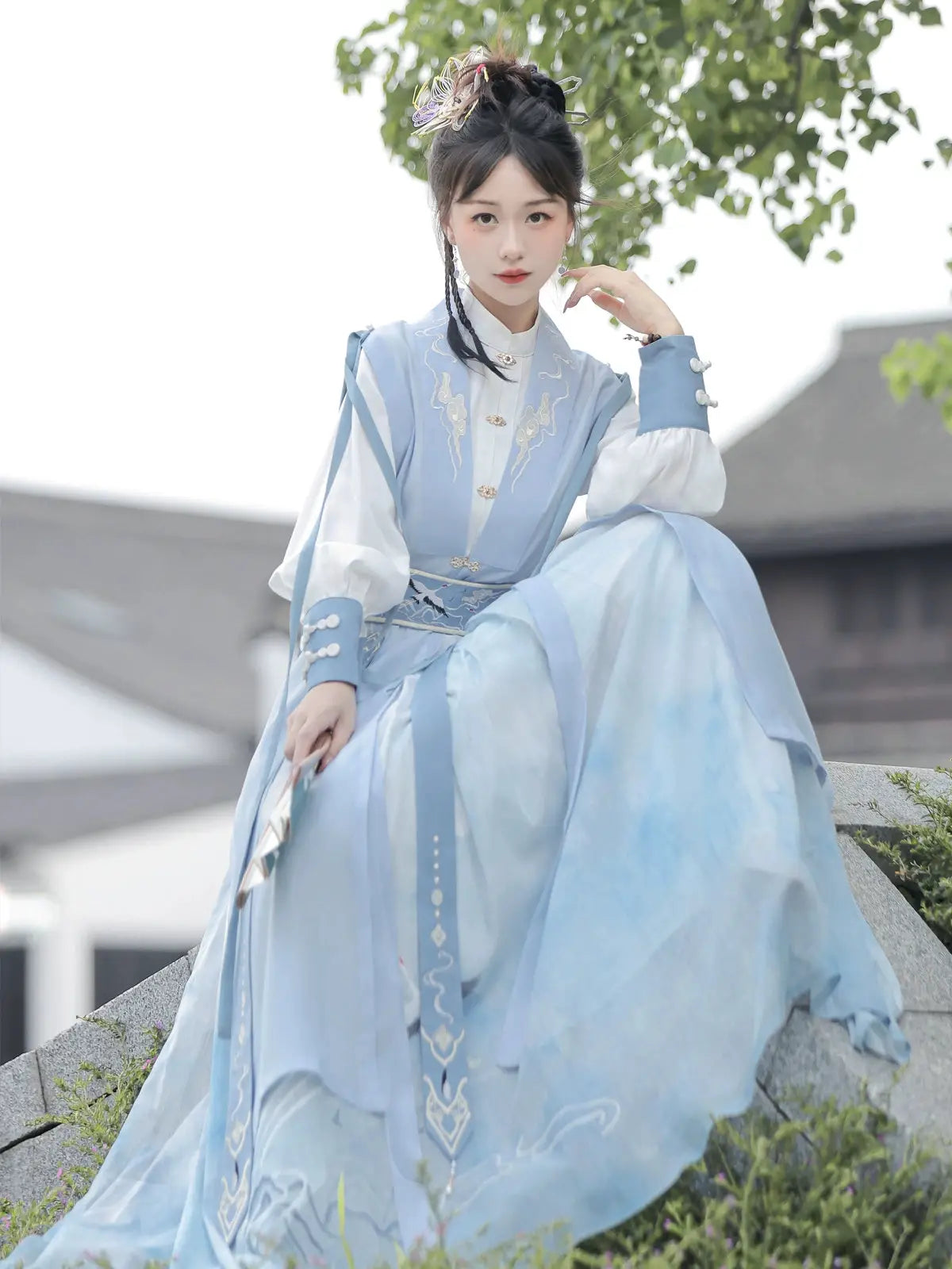 Blue hanfu dress for women, blending traditional Song Dynasty and modern Chinese styles, crafted from luxurious silk. This versatile hanfu includes options for a matching coat or jacket, making it suitable for winter wear, Chinese New Year celebrations, or casual outings. Ideal for occasions like graduations or cosplay, this dress embodies the fairy-inspired elegance of classic hanfu while also drawing from martial arts clothing and contemporary Chinese fashion. Available for purchase in our online hanfu sh